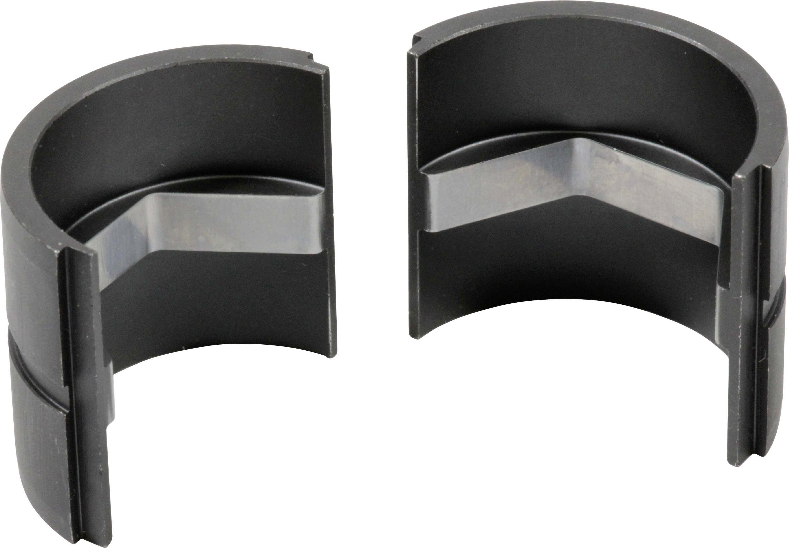 Due parti in plastica nera a forma di semicerchio, con inserti metallici, che sono disposte una accanto all'altra e si adattano per connettersi.