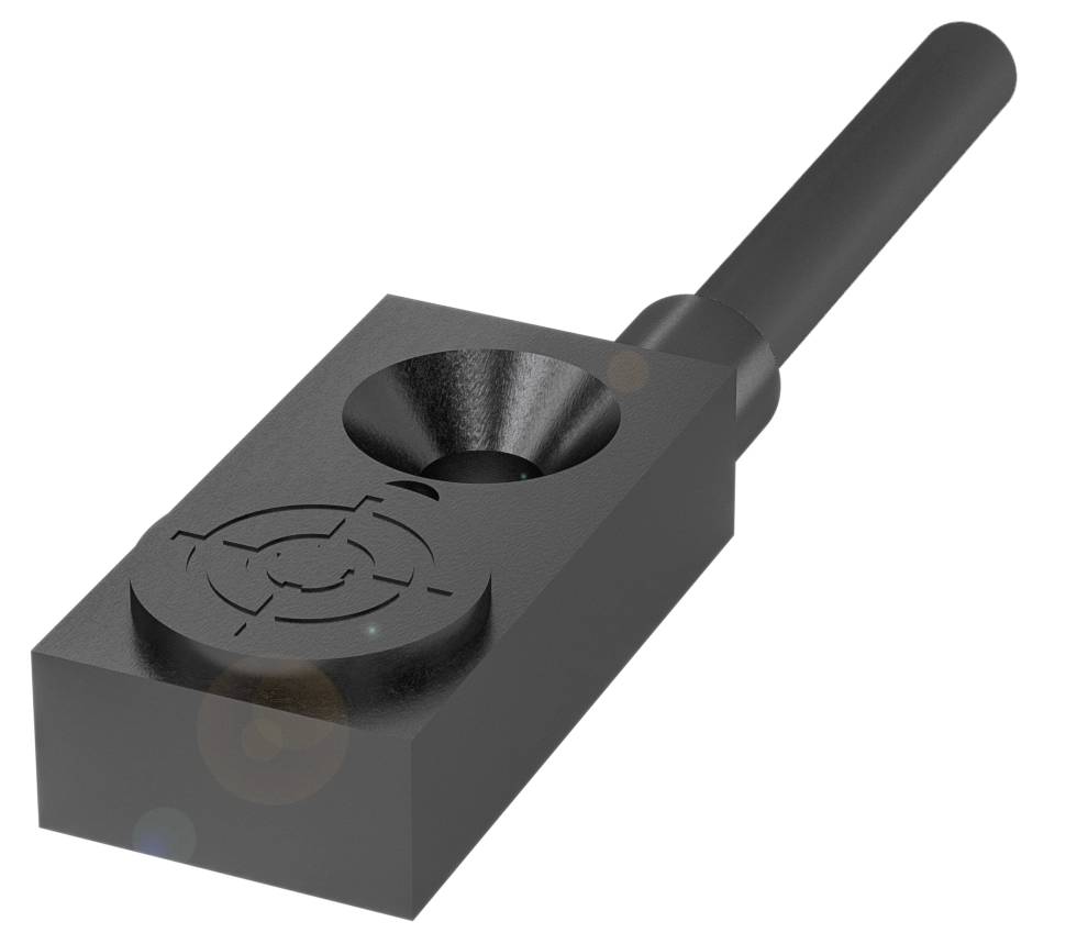 Un componente metallico con un'impugnatura cilindrica e una base rettangolare con motivo complesso.
