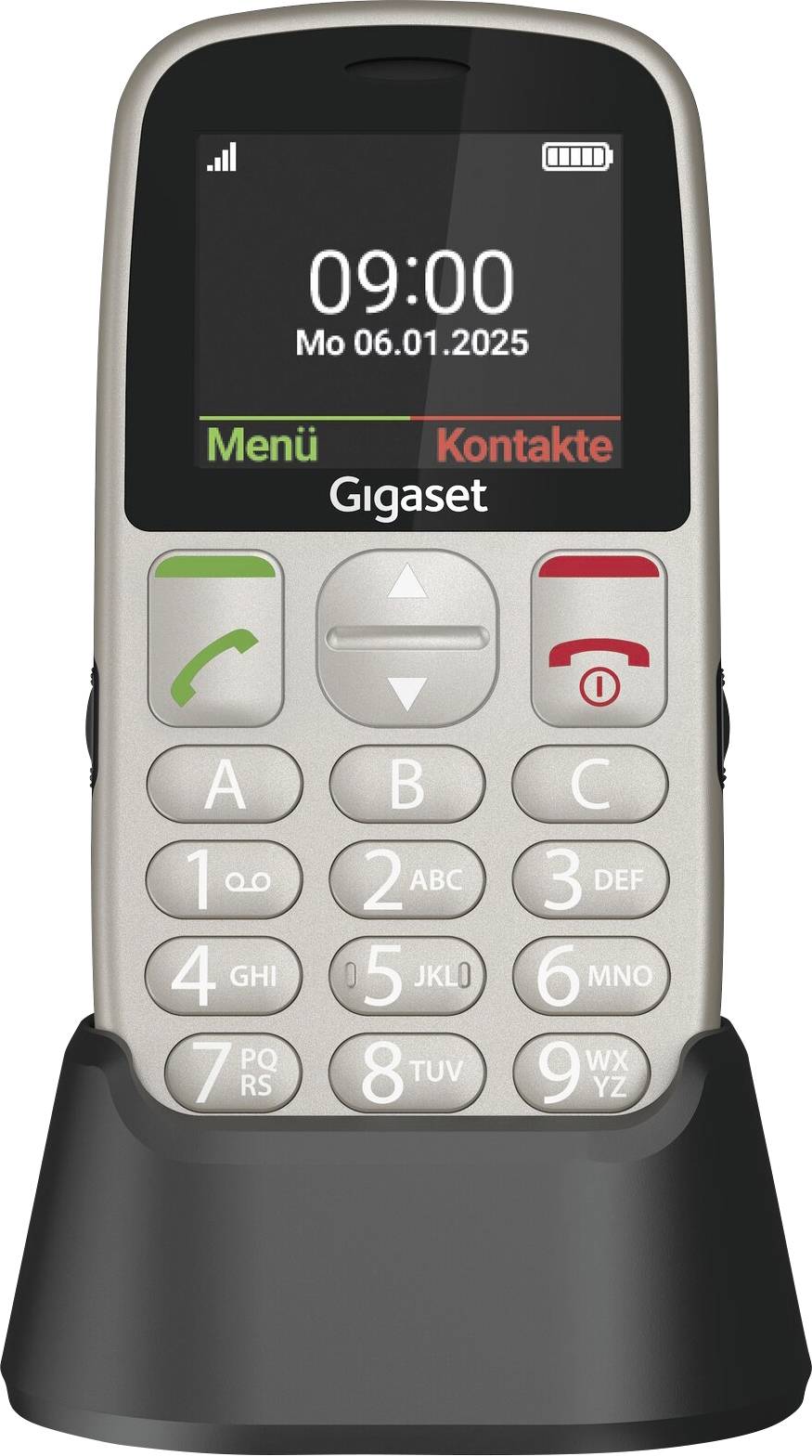 Un telefono cellulare argentato con tastiera grande in un supporto. Il display mostra 'Lun 06.01.2025, 09:00'. Opzioni per 'Menu' e 'Contatti'.