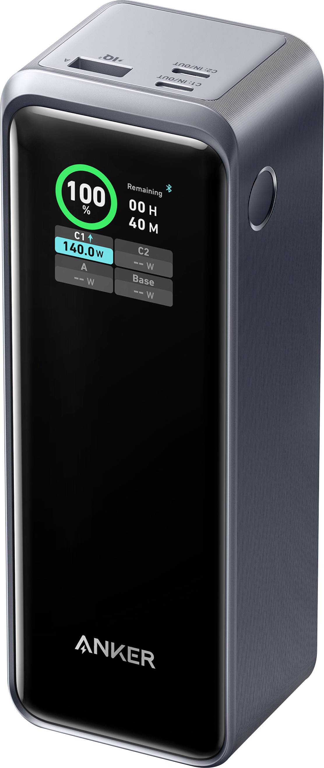 Una power bank Anker alta e rettangolare con un display digitale che mostra '100% rimanente', porte di ricarica sulla parte superiore e un design elegante e scuro.