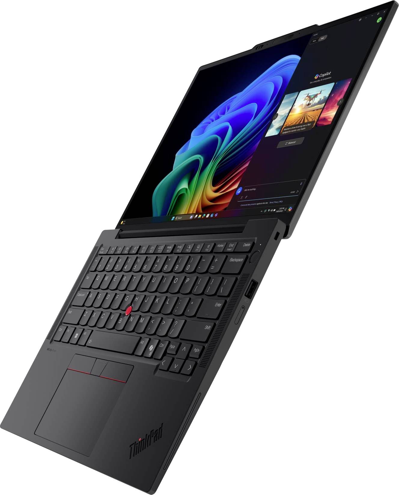 Un laptop nero parzialmente aperto con uno schermo visibile che mostra grafica colorata e una tastiera con un pointing stick rosso.