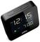Sveglia digitale che mostra '12:15 AM' con allarme impostato per le '7:00 AM', con un pulsante snooze/luce sulla parte superiore.