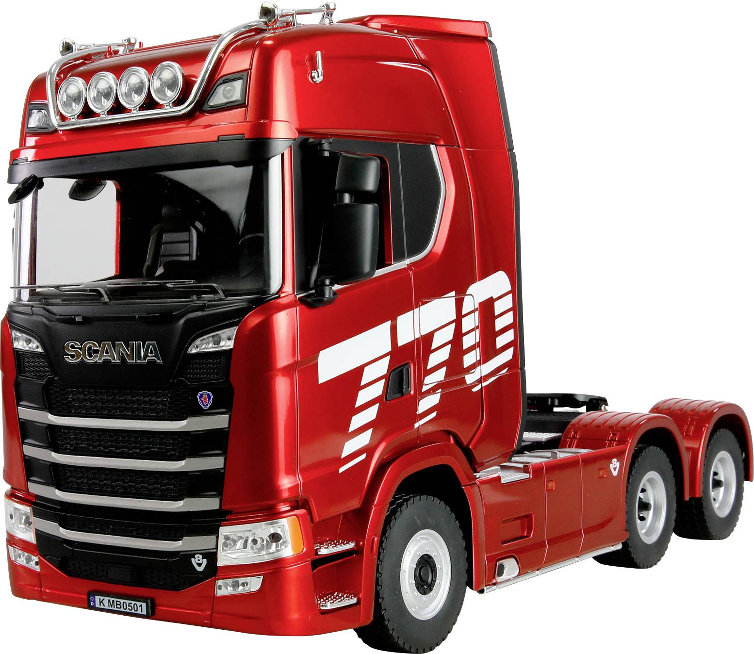 Un robusto cabina di un camion semirimorchio rosso acceso, con un design solido, che reca grandi numeri bianchi '770' sul lato, parcheggiata senza rimorchio agganciato.