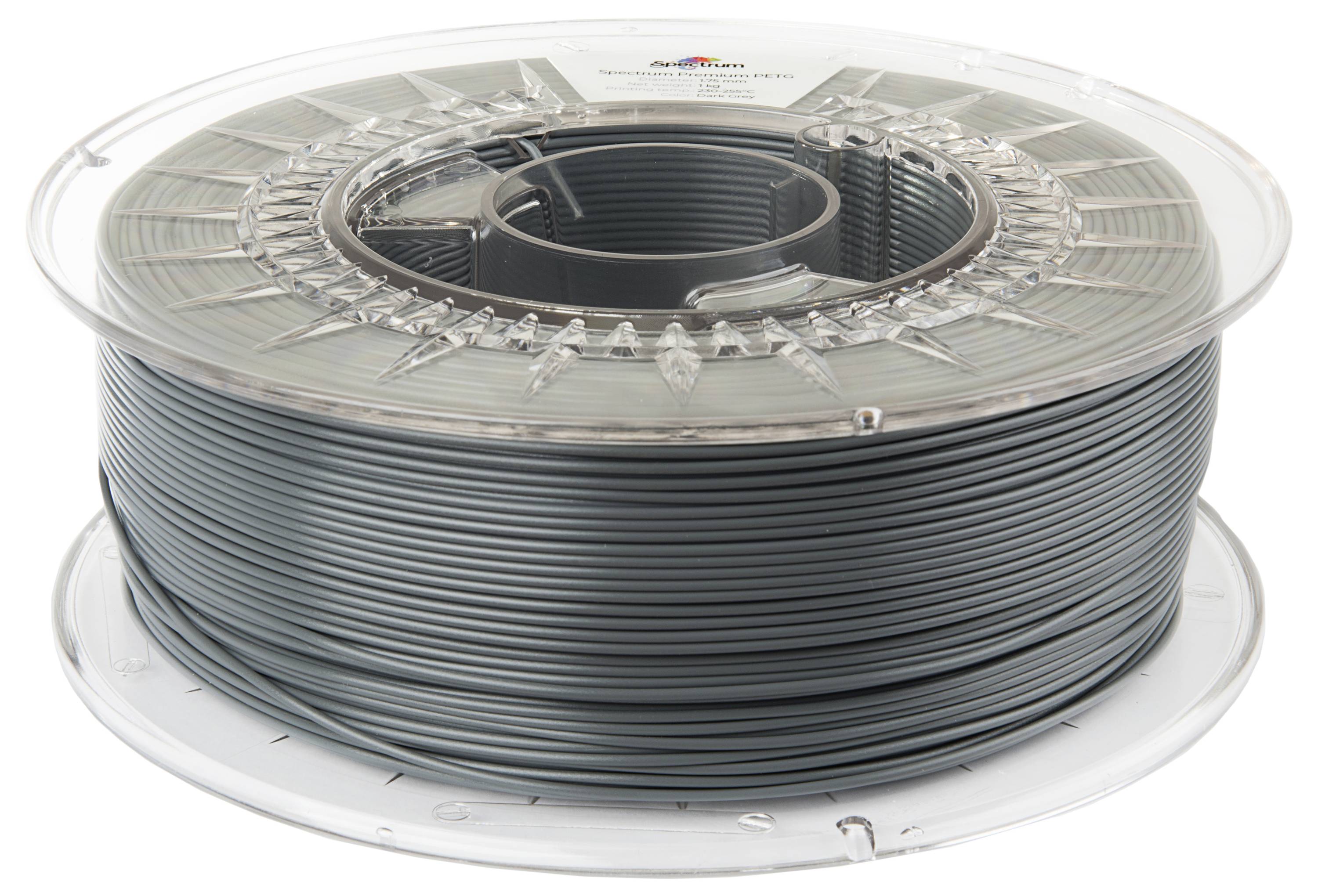 Un rocchetto di filamento per stampante 3D grigio su una bobina di plastica trasparente, che mostra avvolgimenti di filamento strettamente arrotolati.