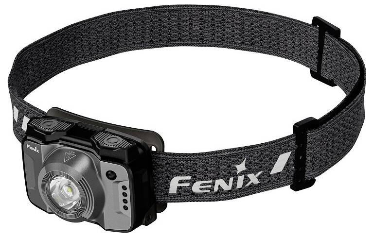 Una lampada frontale nera regolabile con un prominente LED centrale, marchiata 'Fenix' sulla fascia elastica, progettata per l'uso esterno.