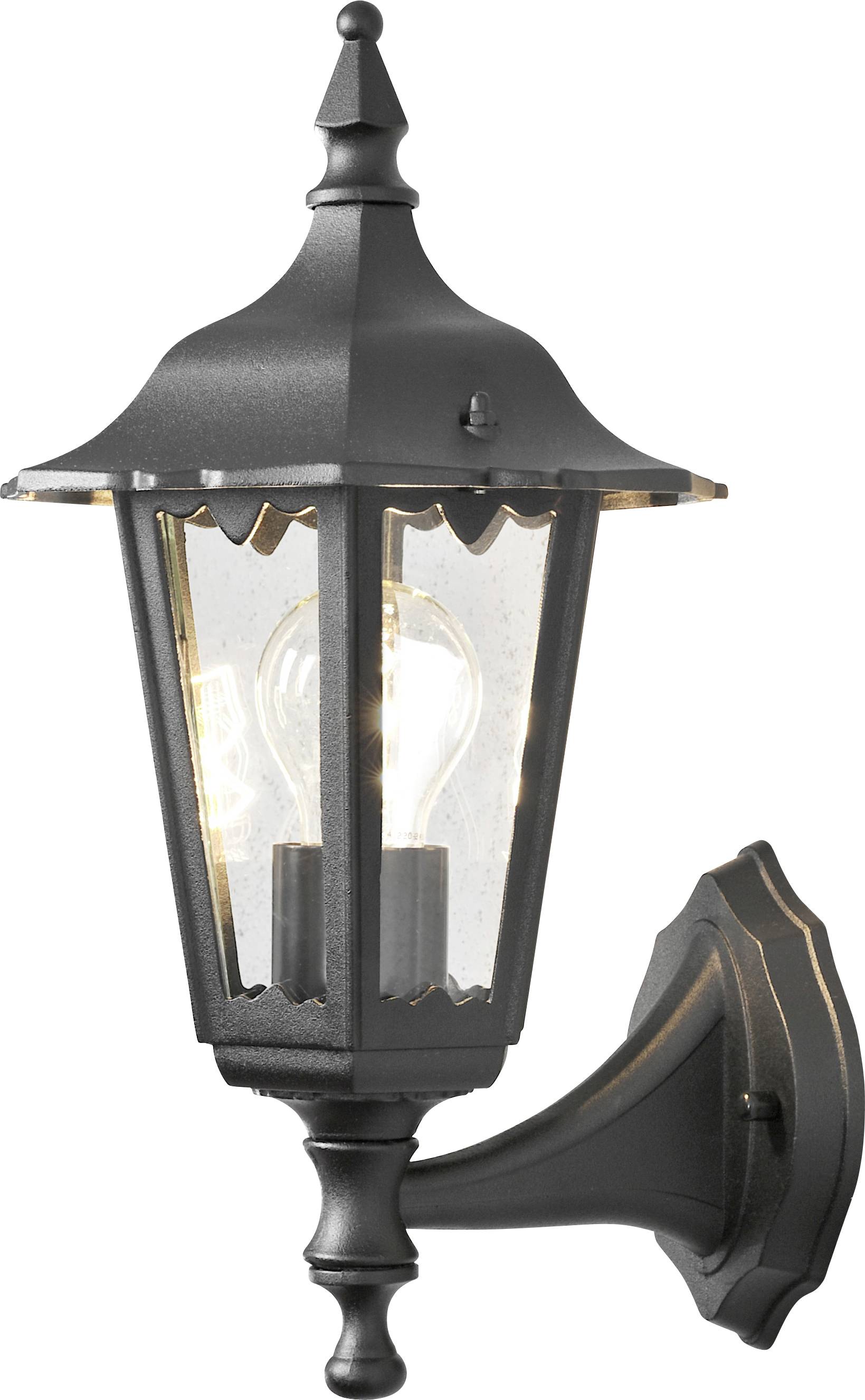 Un'applique da esterno vintage in nero con paralume in vetro trasparente e lampadina a vista, montata su una base decorativa.