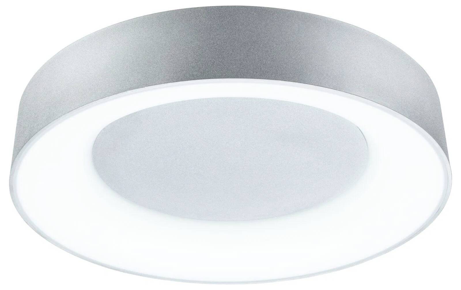 Un'elegante luce a soffitto rotonda, dal design moderno e minimale, con un bordo metallico lucido che emana un'illuminazione luminosa e diffusa.