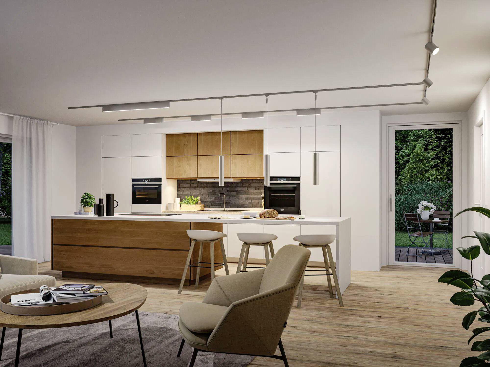 Cucina moderna con isola in legno, armadi bianchi e elettrodomestici integrati. Sgabelli al bancone dell'isola. Porta a vetri che si apre sul patio.