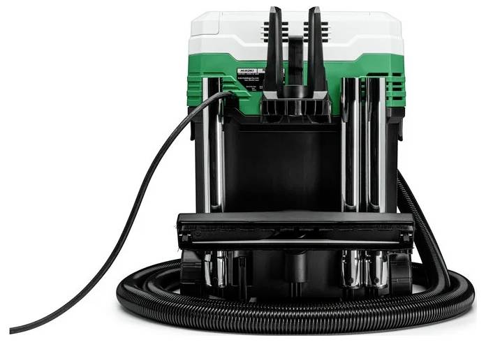 Un utensile elettrico con un corpo verde e bianco, dotato di molteplici tubi e cavi, progettato per uso industriale pesante.