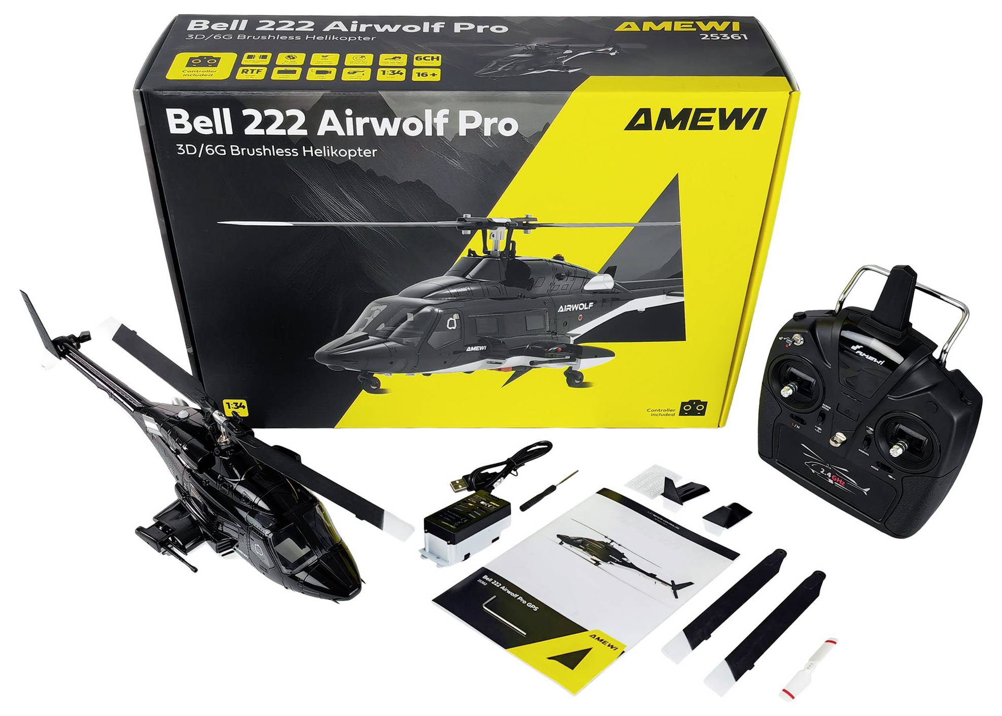 Set di elicottero telecomandato 'Bell 222 Airwolf Pro' con radiocomando, manuale e accessori posizionati davanti alla sua scatola originale.