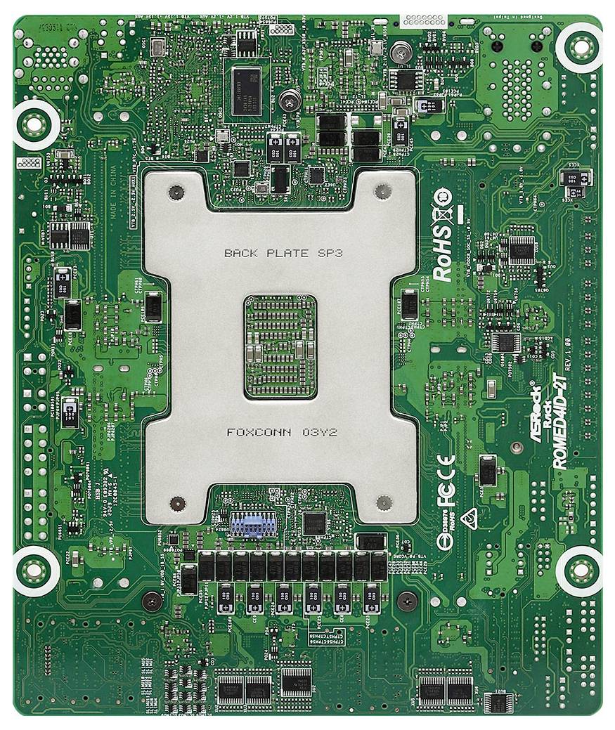 Scheda madre per computer verde con vari circuiti e componenti, che presenta un quadrato centrale argentato con l'etichetta 'BACK PLATE SP3'.