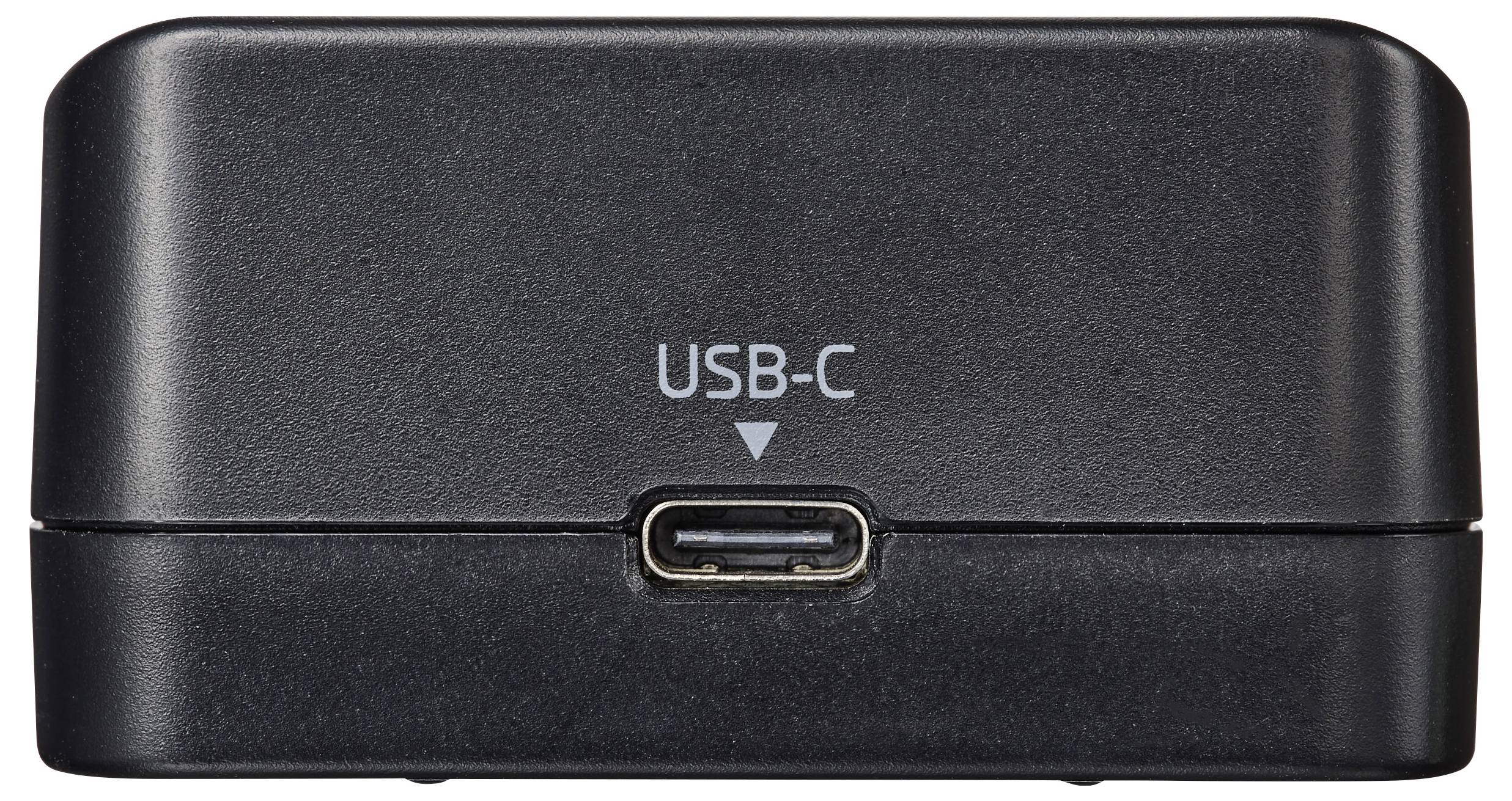Un dock di ricarica nero con una porta USB-C visibile etichettata 'USB-C'.