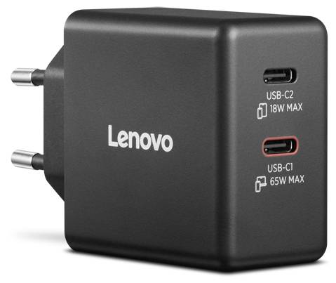 L'immagine mostra un caricabatterie USB dual-port nero Lenovo con due porte USB-C etichettate 'USB-C2 18W MAX' e 'USB-C1 65W MAX.'