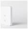 Un dispositivo rettangolare bianco con una spia luminosa e un piccolo logo sul davanti, probabilmente un sensore o un dispositivo per la domotica, posizionato su uno sfondo bianco.