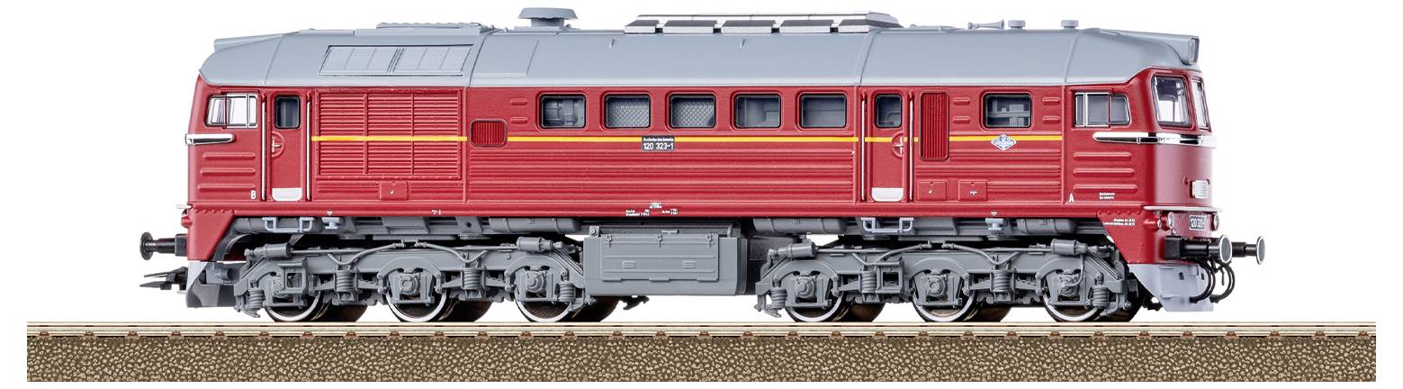 Un treno modello con livrea blu e bianca su un binario attraverso un terreno erboso. Il treno è contrassegnato con 'DB' e 'Kaltenkirchen'.