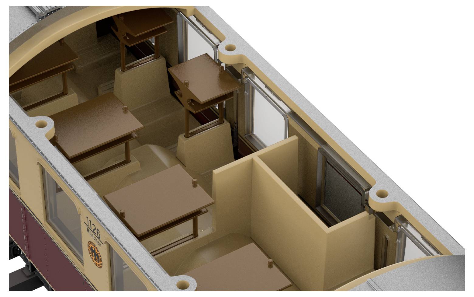 Un piccolo vagone del trenino carico di carbone, su binari circondati da erba, che mostra un paesaggio in miniatura dettagliato.