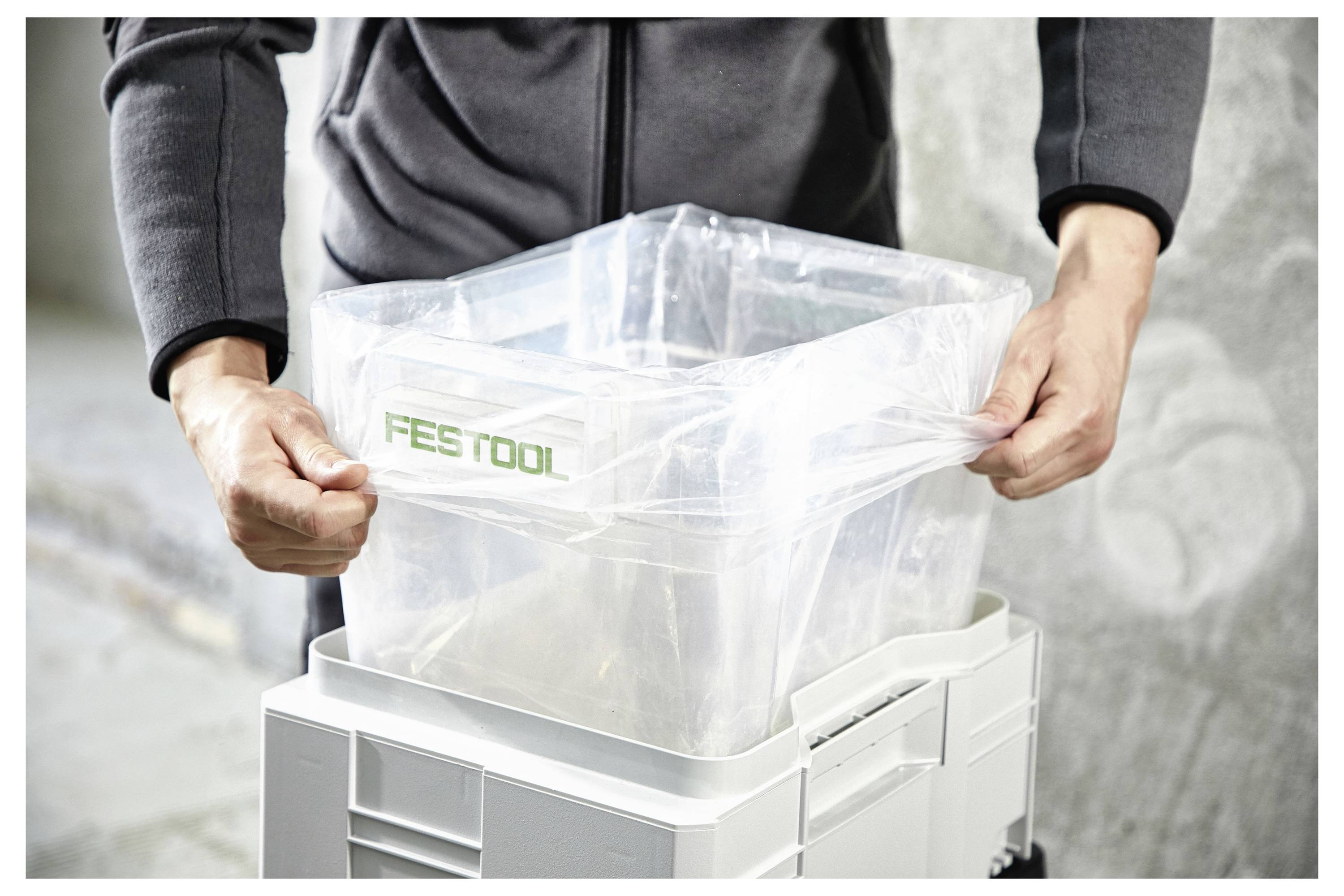 Una persona sta utilizzando una levigatrice elettrica per levigare una superficie in legno, probabilmente per rifinire o preparare il legno per la pittura o la verniciatura.