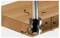 Punta router che crea un profilo di spigolo su un pezzo di legno; gli elementi etichettati includono D (diametro), R1 e R2 (raggi), e NL (lunghezza del collo).