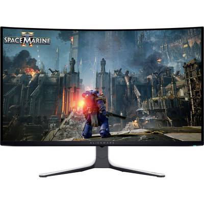 Un monitor di computer che visualizza una scena dal gioco "Warhammer 40,000: Space Marine 2", con una figura corazzata futuristica in un paesaggio urbano distopico.
