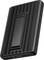 Un elegante power bank portatile nero con superficie strutturata e indicatori LED sul bordo inferiore, adatto per caricare i dispositivi in movimento.