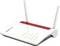 Un router bianco con due antenne, etichettato "FRITZ! Box", mostra quattro spie luminose accese per alimentazione, WLAN, LAN e stato della connessione.