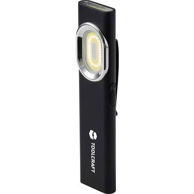 Luce di lavoro LED con clip Toolcraft nera con testina illuminata circolare e pulsante di alimentazione laterale, mostrata in posizione verticale su sfondo bianco.