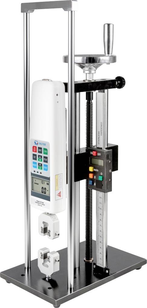 Un misuratore di forza digitale montato su un banco di prova verticale con supporti in metallo. Il dispositivo presenta uno schermo di visualizzazione e vari pulsanti di controllo.