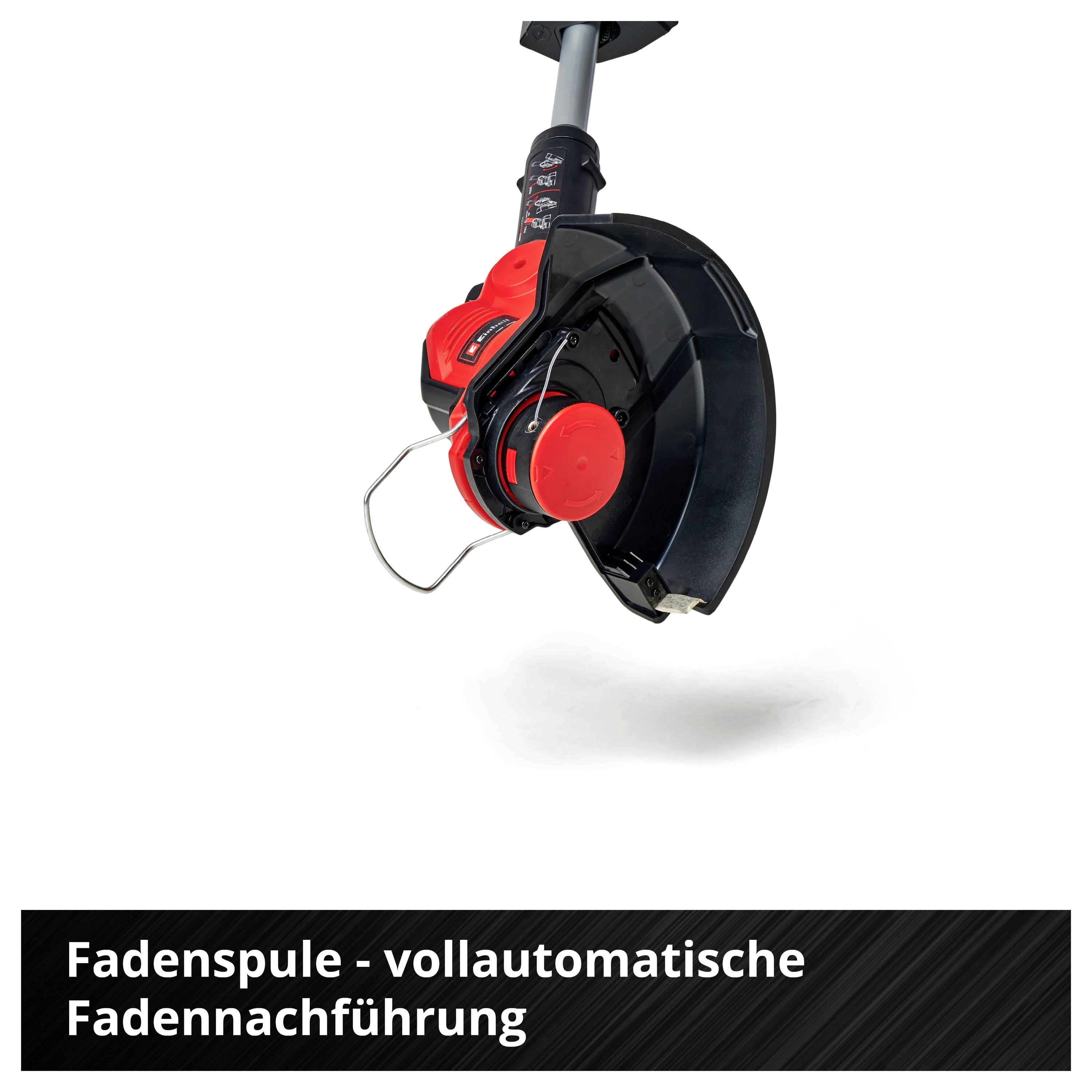 'Rocchetto di filo - avanzamento automatico del filo.' Immagine di un decespugliatore con un rocchetto di filo automatico nero e rosso, isolato su sfondo bianco.