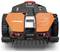 Un robot tosaerba arancione e nero con il logo 'Landroid' sul frontale, dotato di cingoli e sensori, progettato per la manutenzione automatizzata del prato.
