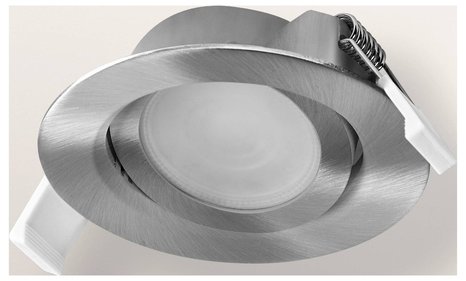 Un apparecchio di illuminazione da incasso a soffitto in metallo spazzolato con design circolare e due clip bianche.