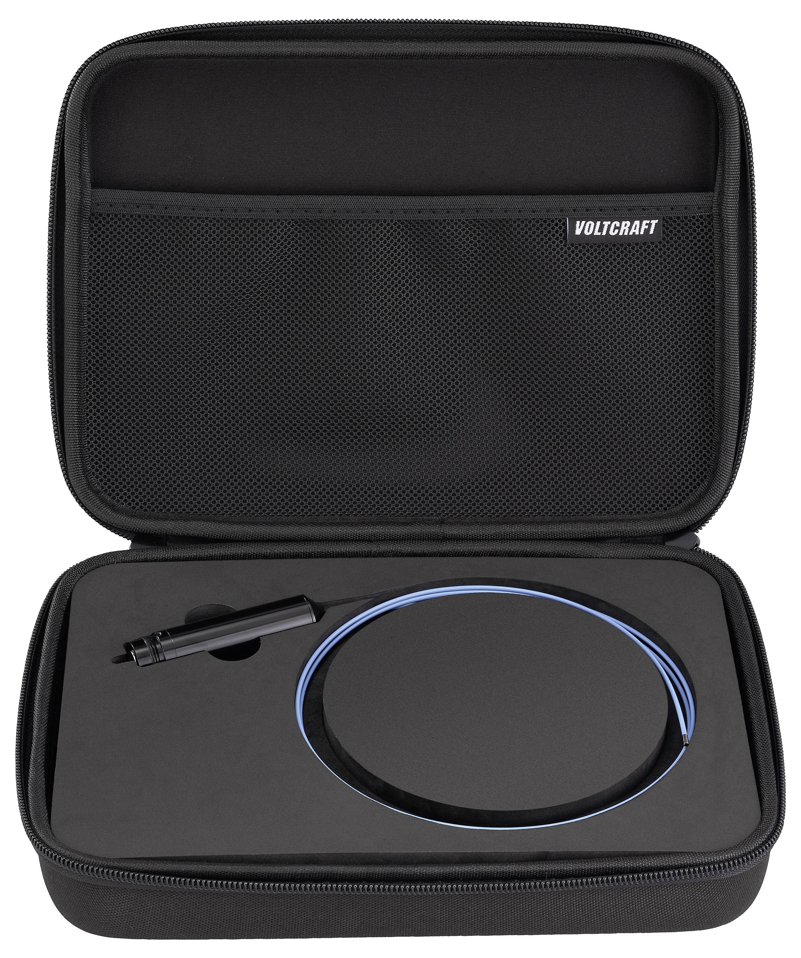 Custodia da trasporto nera con cerniera con etichetta VOLTCRAFT, contenente un dispositivo nero rotondo con cavo blu e un piccolo accessorio sonda.