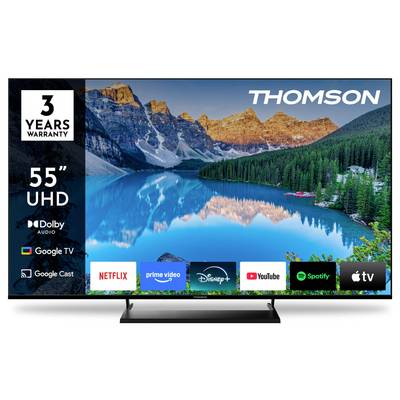 Un televisore Thomson da 55 pollici UHD che visualizza una scena di lago di montagna. Le caratteristiche includono garanzia di 3 anni, Dolby Audio, Google TV, con icone di app come Netflix e YouTube.