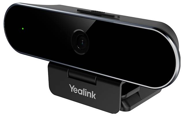 Una webcam nera con un singolo obiettivo e una piccola luce LED sul lato sinistro è montata su una clip con il marchio "Yealink".