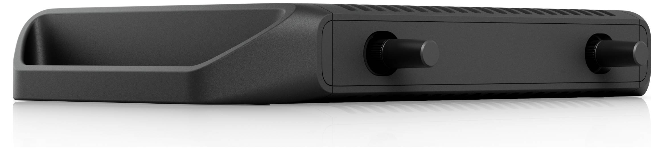 Un elegante dispositivo elettronico nero con due manopole di controllo e una presa d'aria, probabilmente una console di gioco o un lettore multimediale, visto da un'angolazione bassa.