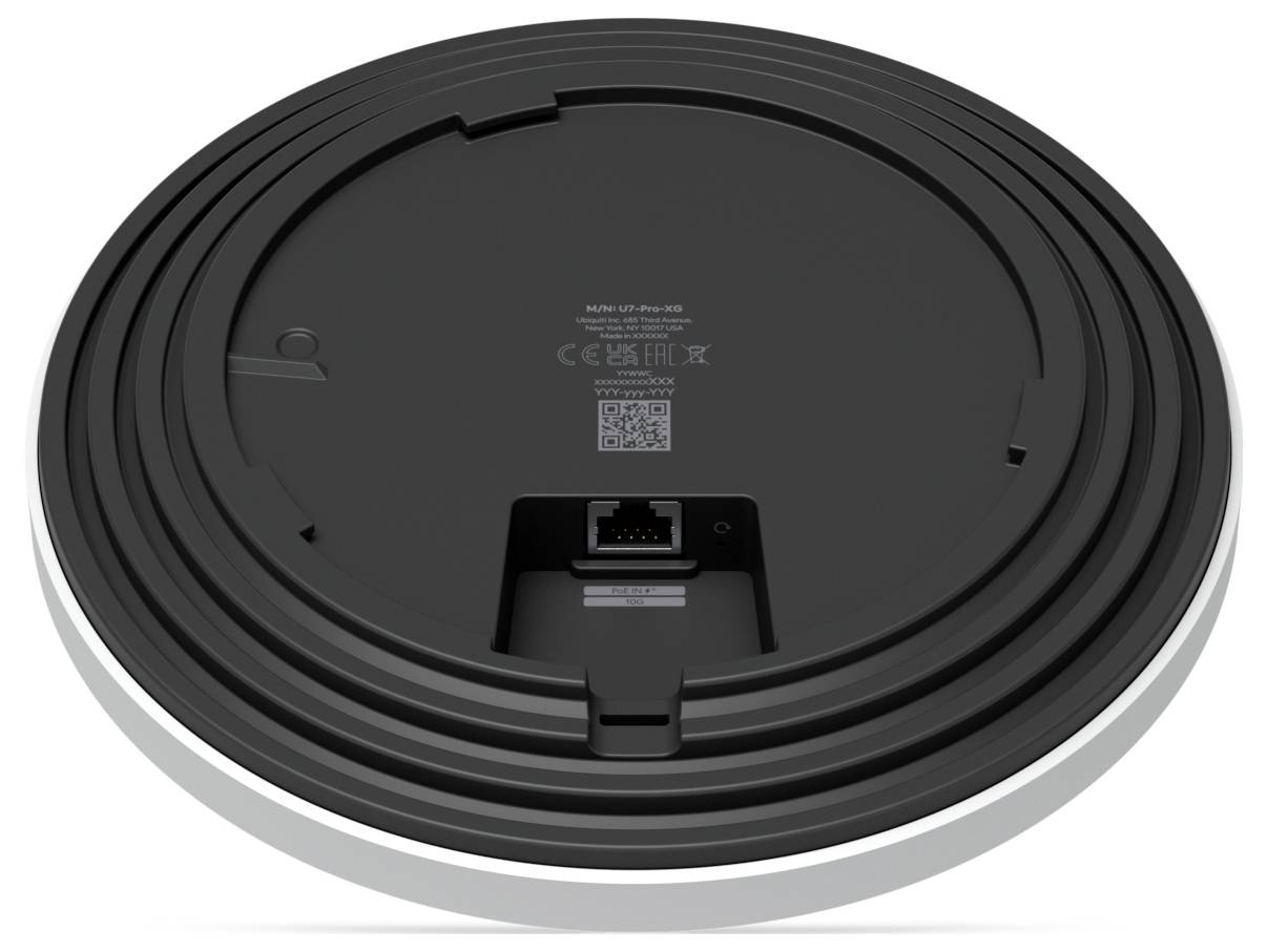Vista inferiore di un dispositivo elettronico circolare con una porta Ethernet al centro, circondata da scanalature circolari.