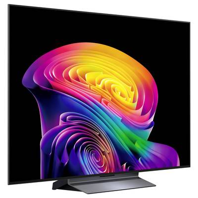 Un sottile monitor nero mostrato da dietro, centrato su uno sfondo bianco, con un ampio piedistallo e una cerniera circolare o supporto al centro.