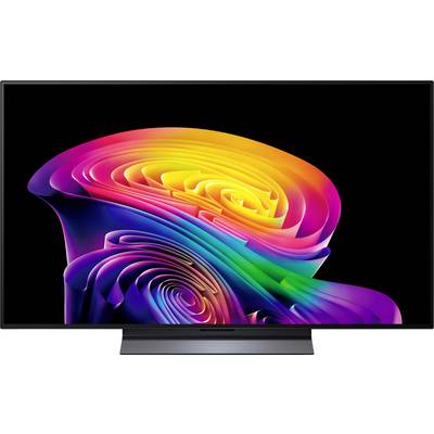 Una televisione a schermo piatto che mostra un vivace vortice arcobaleno astratto su uno sfondo nero, al centro dello schermo.