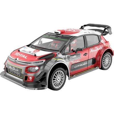 Auto da rally Citroën rossa e nera con adesivi da corsa, alettone posteriore e loghi degli sponsor, mostrata su sfondo bianco.