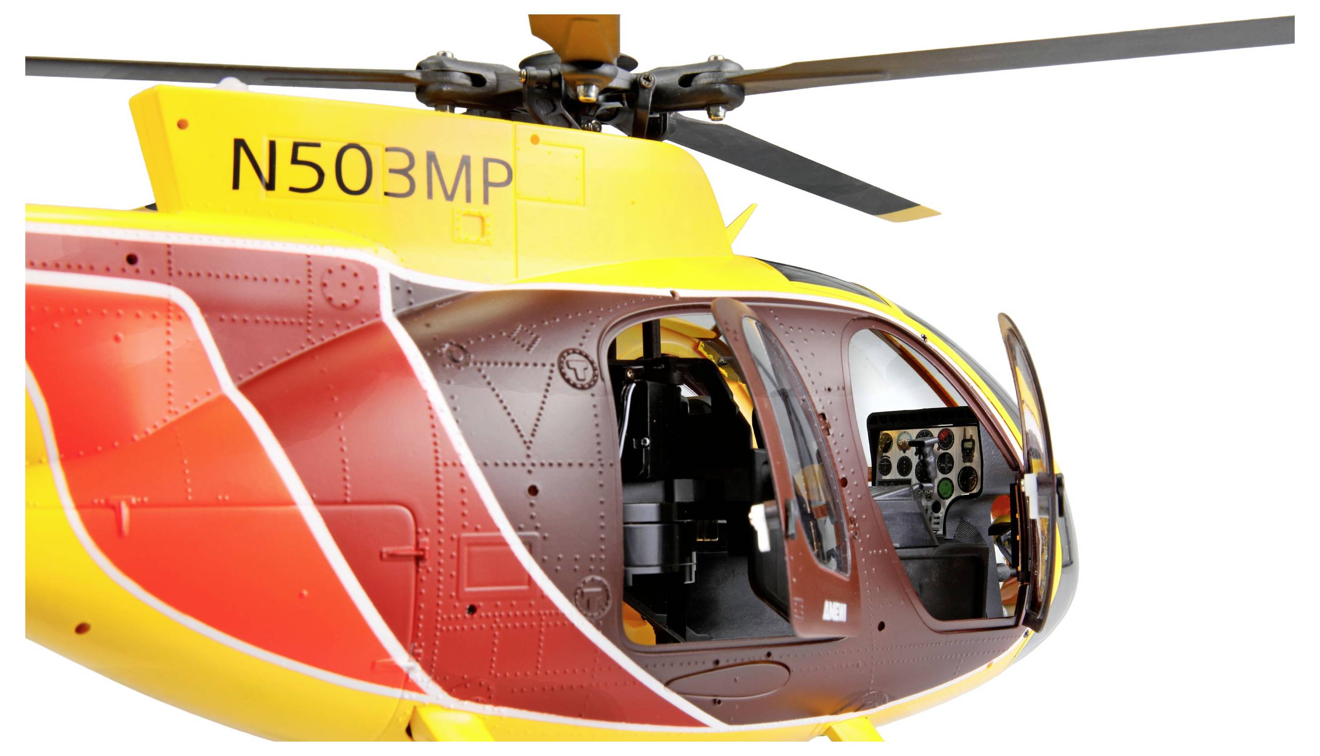 Elicottero giallo e rosso con portiera laterale aperta, cabina di pilotaggio visibile, matricola "N503MP" sulla fusoliera.