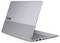 Laptop Lenovo ThinkBook argentato parzialmente aperto, visto da dietro a sinistra con tastiera visibile e porte laterali su sfondo bianco.