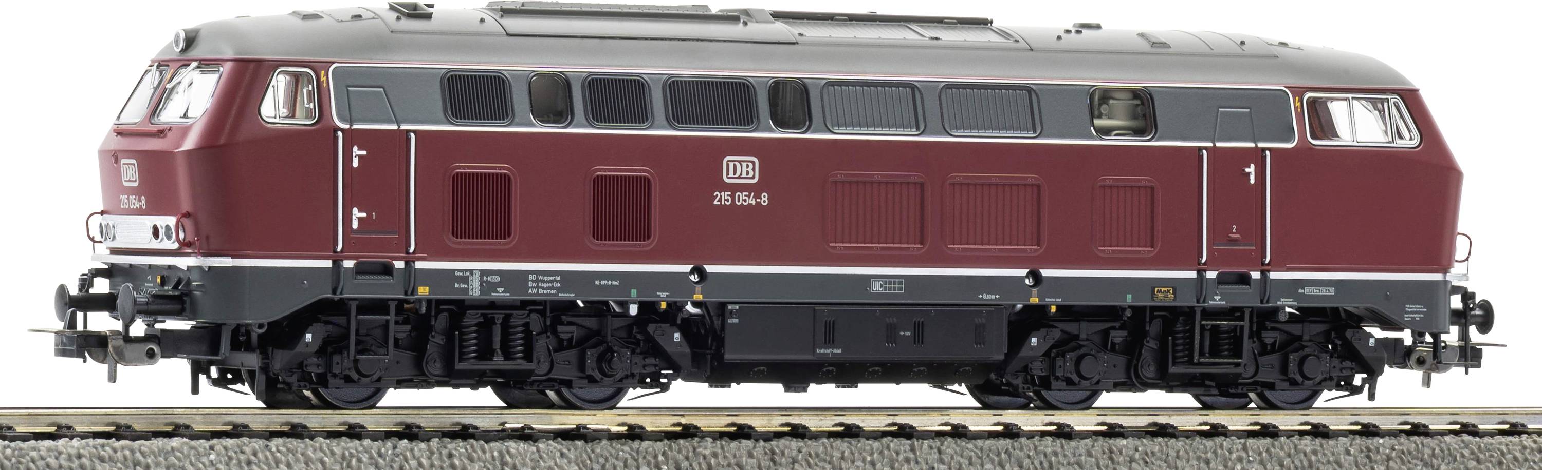 Locomotore diesel marrone in vista laterale su un breve tratto di binario, con tetto argento e sottocarro nero.
