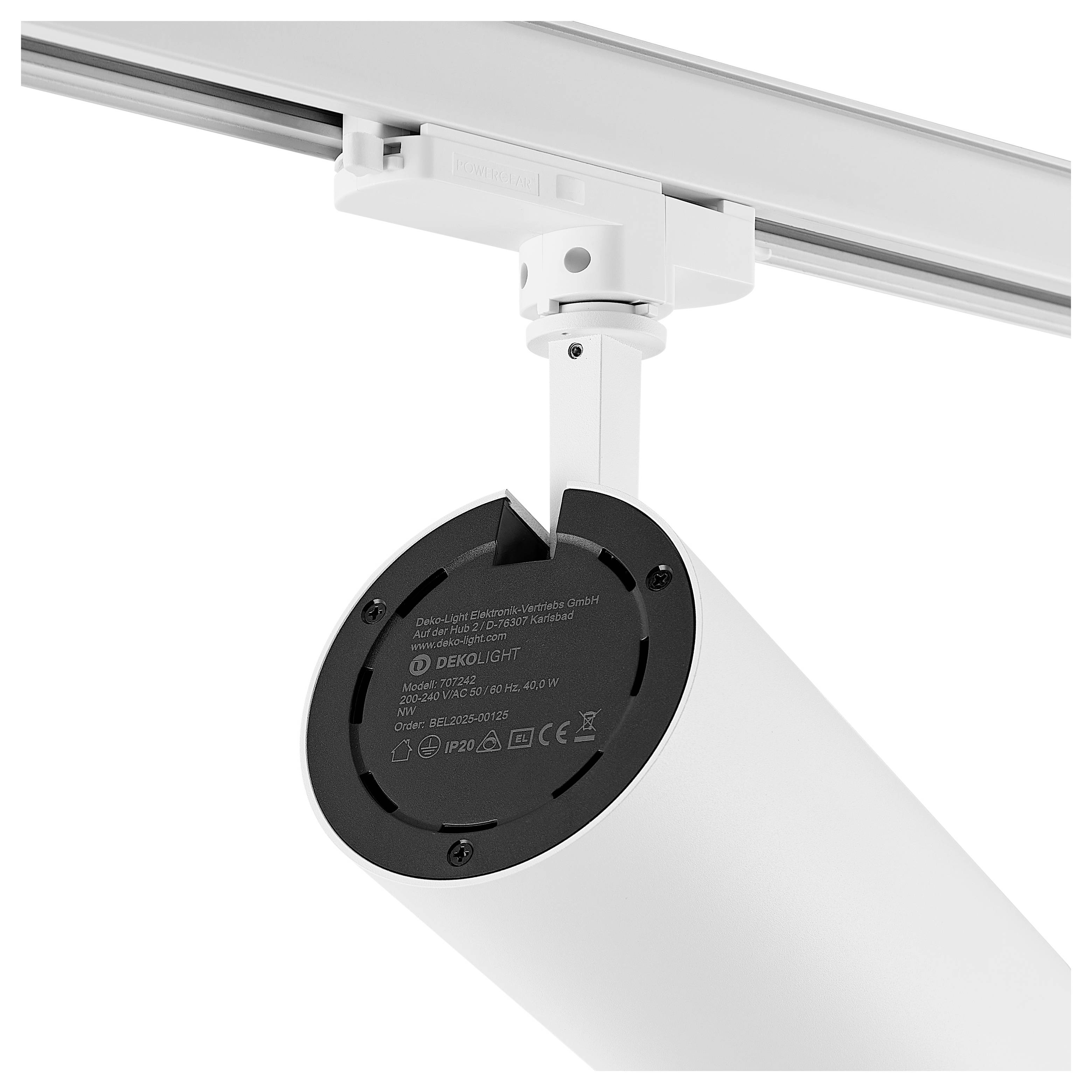 Faretto su binario bianco orientato verso il basso, con testata lampada circolare nera su rotaia a soffitto.