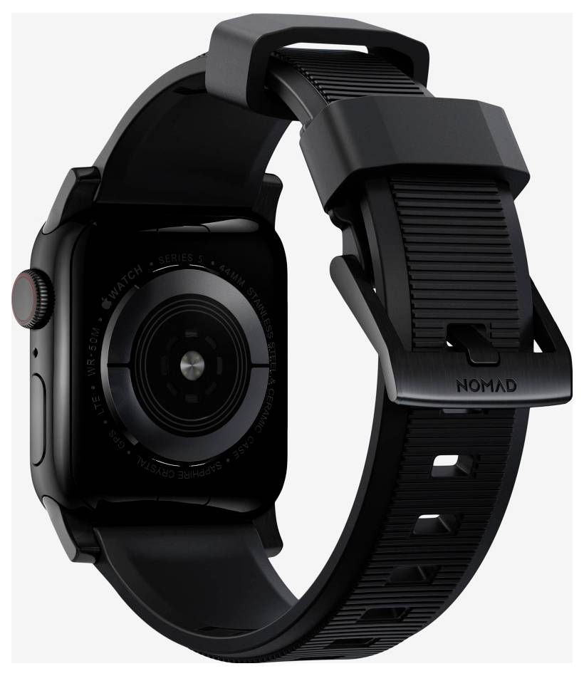 Apple Watch nero con cinturino sportivo NOMAD nero robusto mostrato in profilo su sfondo bianco.
