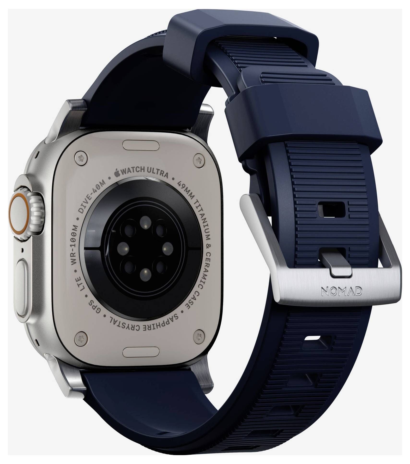 Apple Watch Ultra con cinturino Nomad blu navy, mostrato da dietro per evidenziare la cassa dell'orologio, il sensore e l'attacco del cinturino.