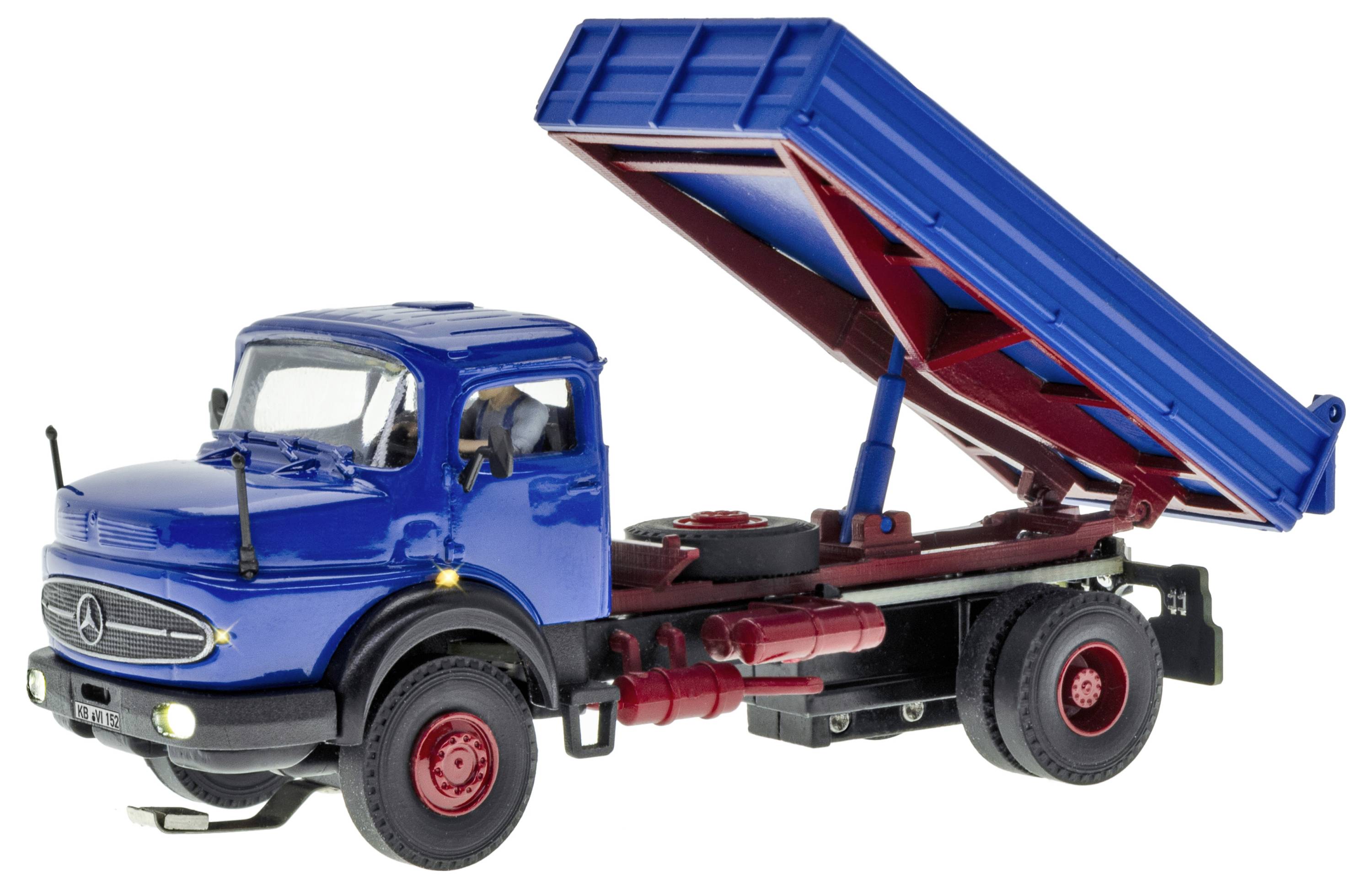 Modello di camion ribaltabile blu con cassone sollevato, mostrato in vista laterale su sfondo bianco.