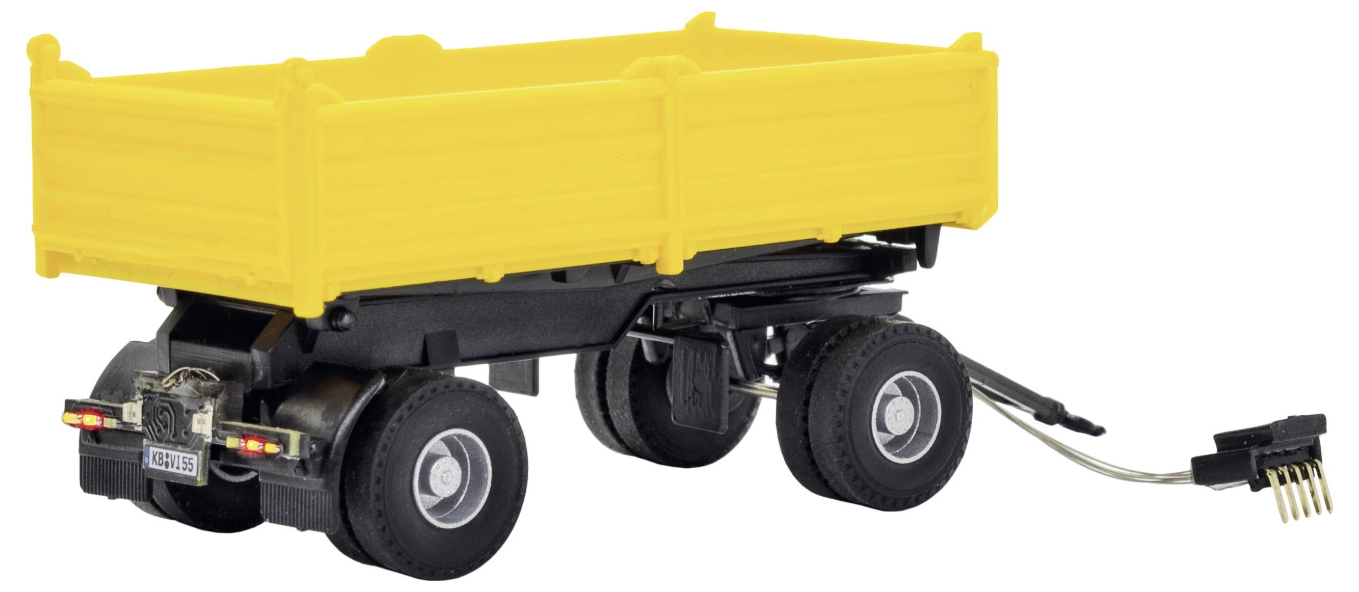 Rimorchio agricolo giallo con quattro ruote e gancio di traino, mostrato in vista laterale su sfondo bianco.