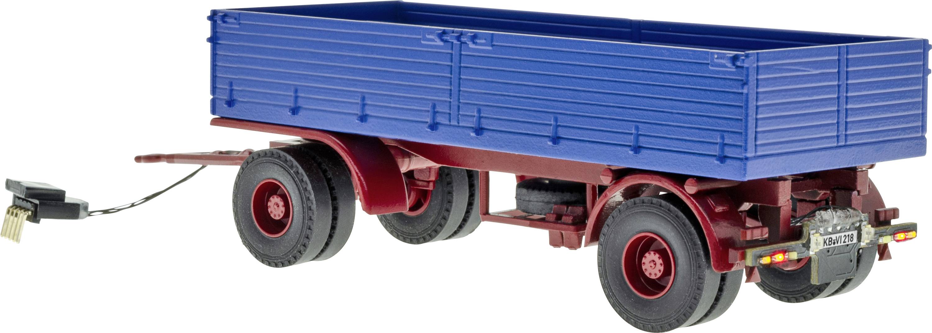 Rimorchio cargo blu con trattore, modello con telaio e ruote rossi, mostrato in vista laterale su sfondo bianco.