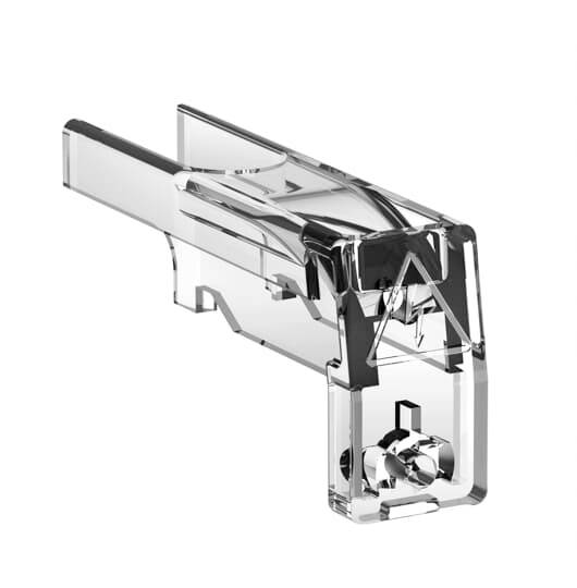 Clip di connettore elettrico in plastica trasparente con contatto a molla metallica all'interno, mostrato su sfondo bianco.