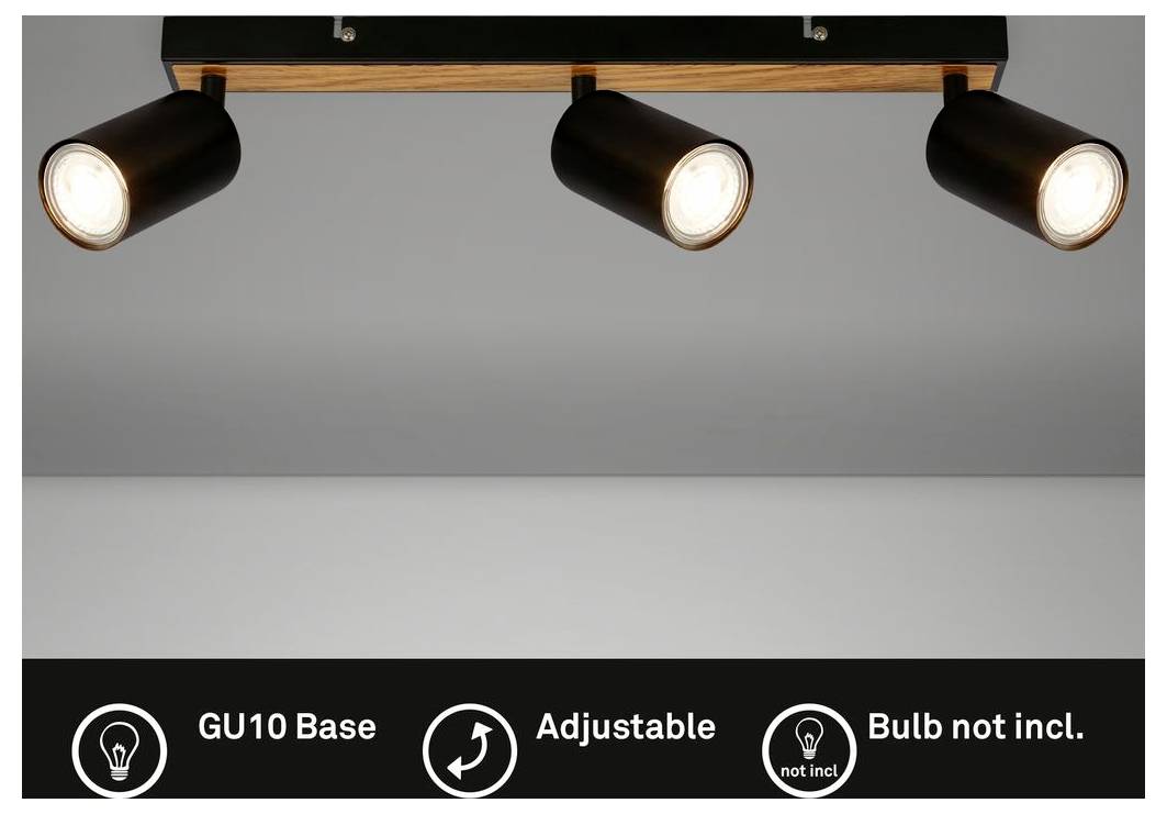 Tre testine di faretto regolabile nero su una guida a soffitto in legno, con base GU10 e lampadina non inclusa.