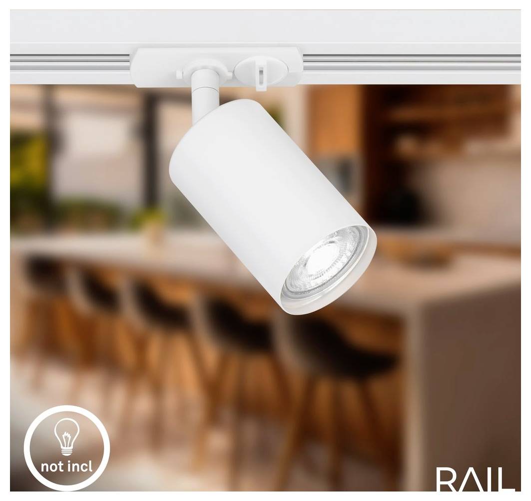 Faretto da binario orientabile bianco montato su una guida, mostrato in un interno cucina moderna sfocato; icona "non incl" e marchio "RAIL" visibili.